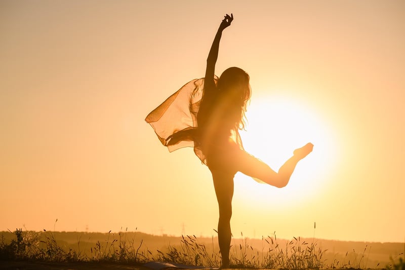 Woman meditating at sunset